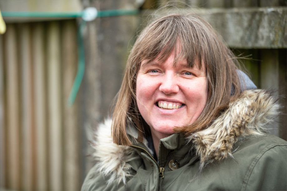 Photo of a woman smiling at the camera