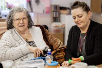 Photo of two people sat at a table