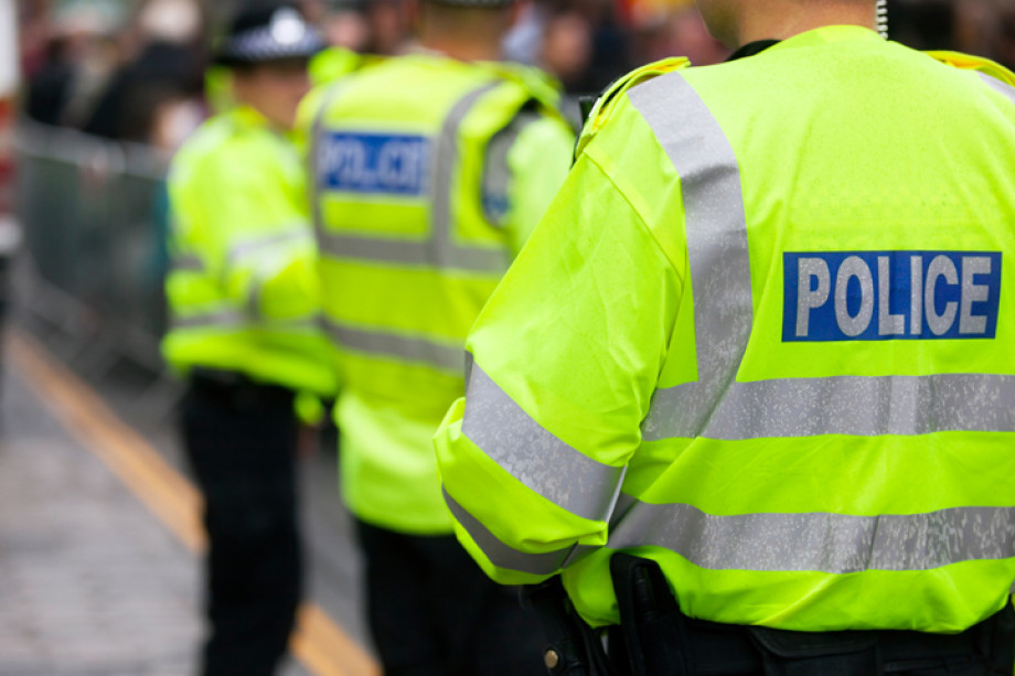 Photo of a group of police with their backs turned