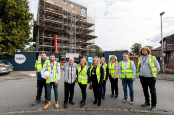 Torus colleagues stand with tenants outside Kingsweay house during the renovation works