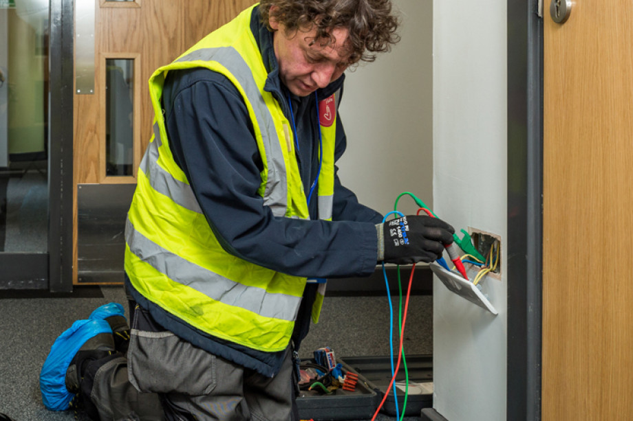 Photo of someone rewiring a socket