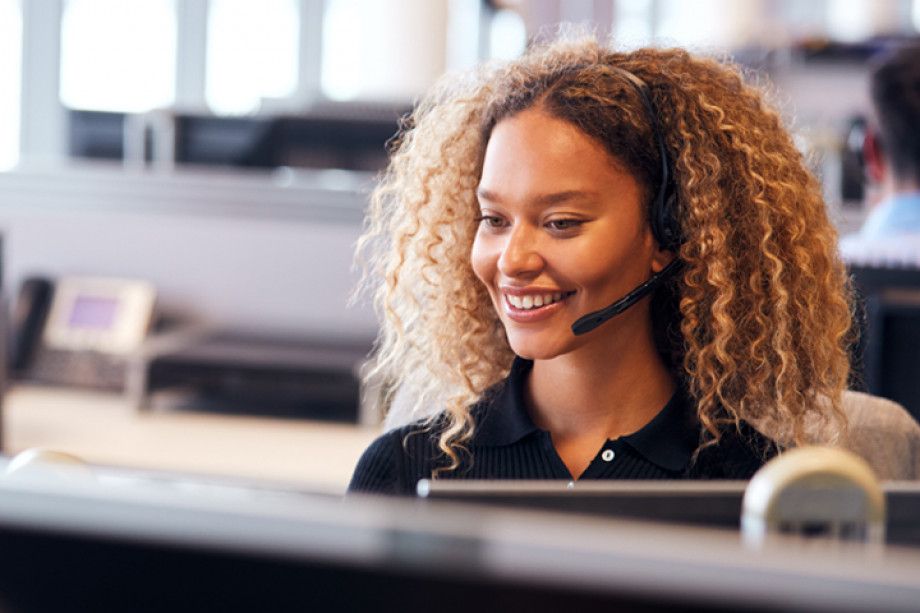 Photo of a person talking on a headset