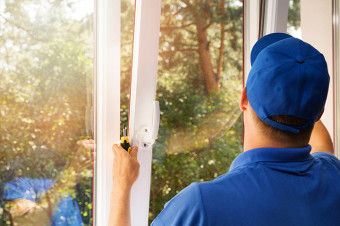 Photo of someone replacing a window